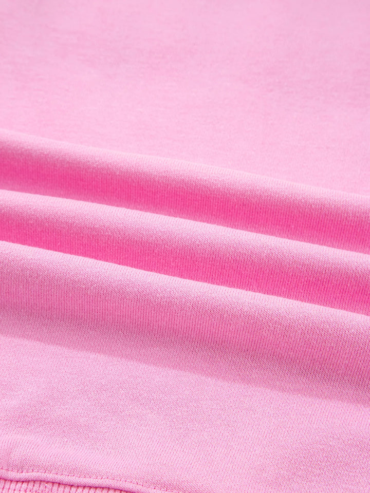 Oversized XOXO graphic sweatshirt with exposed seams and bows