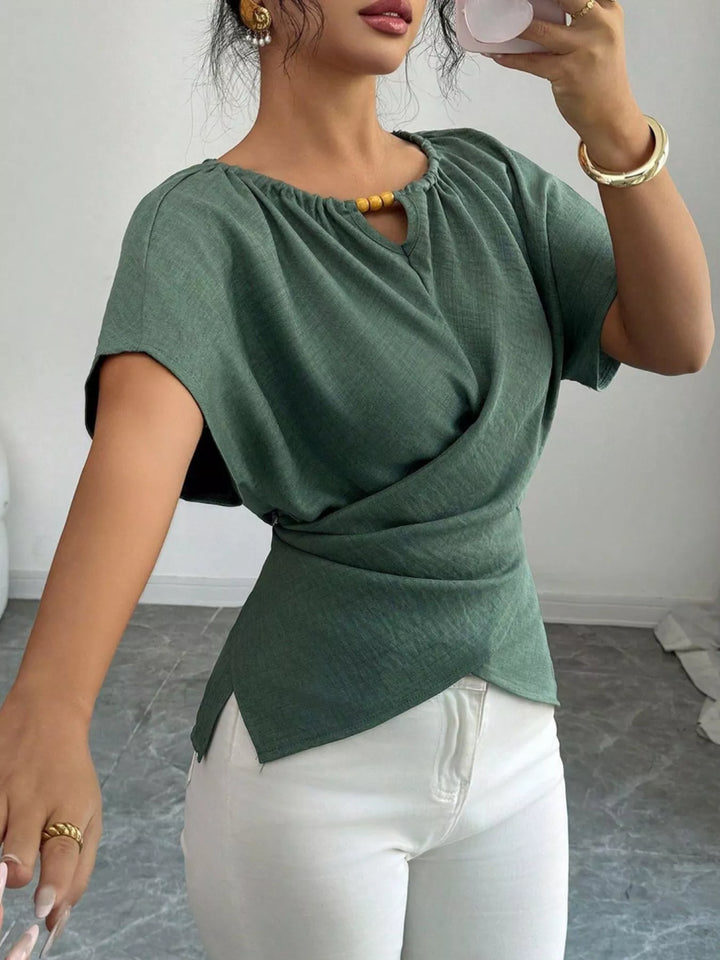 Wrap-front short sleeve blouse with beaded keyhole neckline