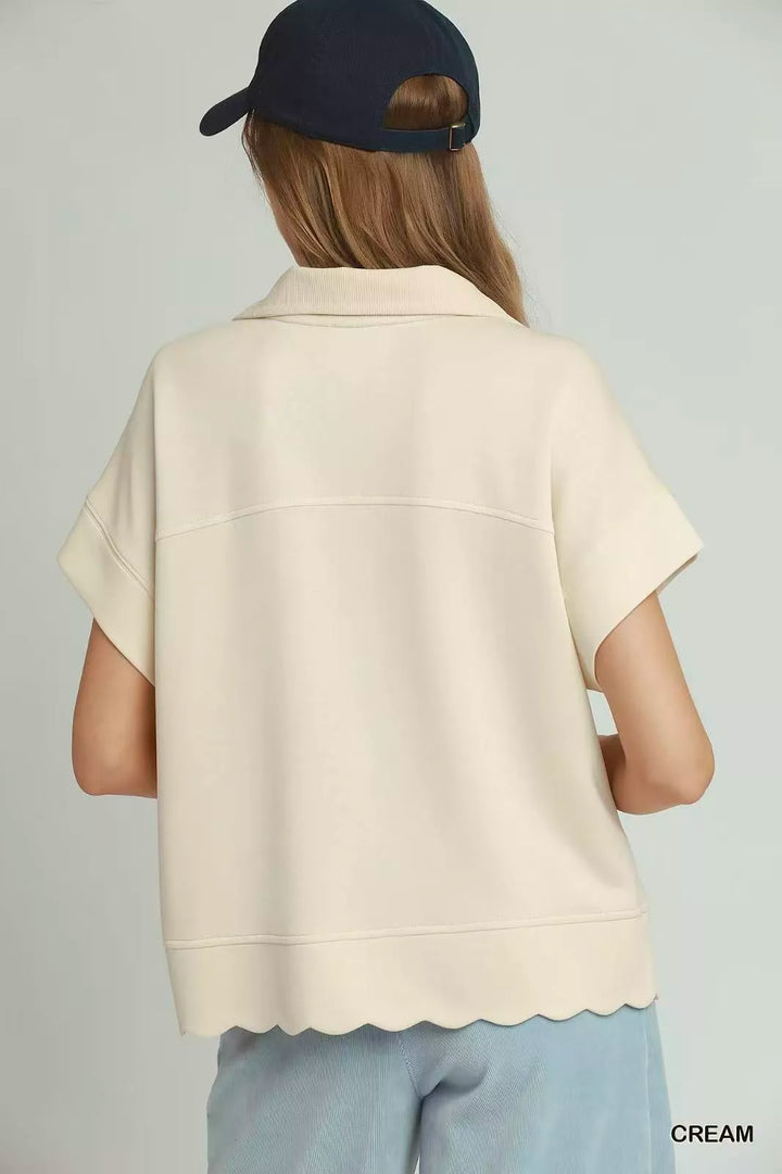 Scalloped hem half-zip short sleeve knit pullover