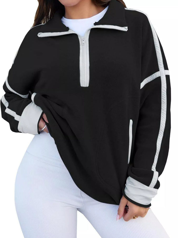 Half-zip fleece pullover with contrast trim and zip pockets