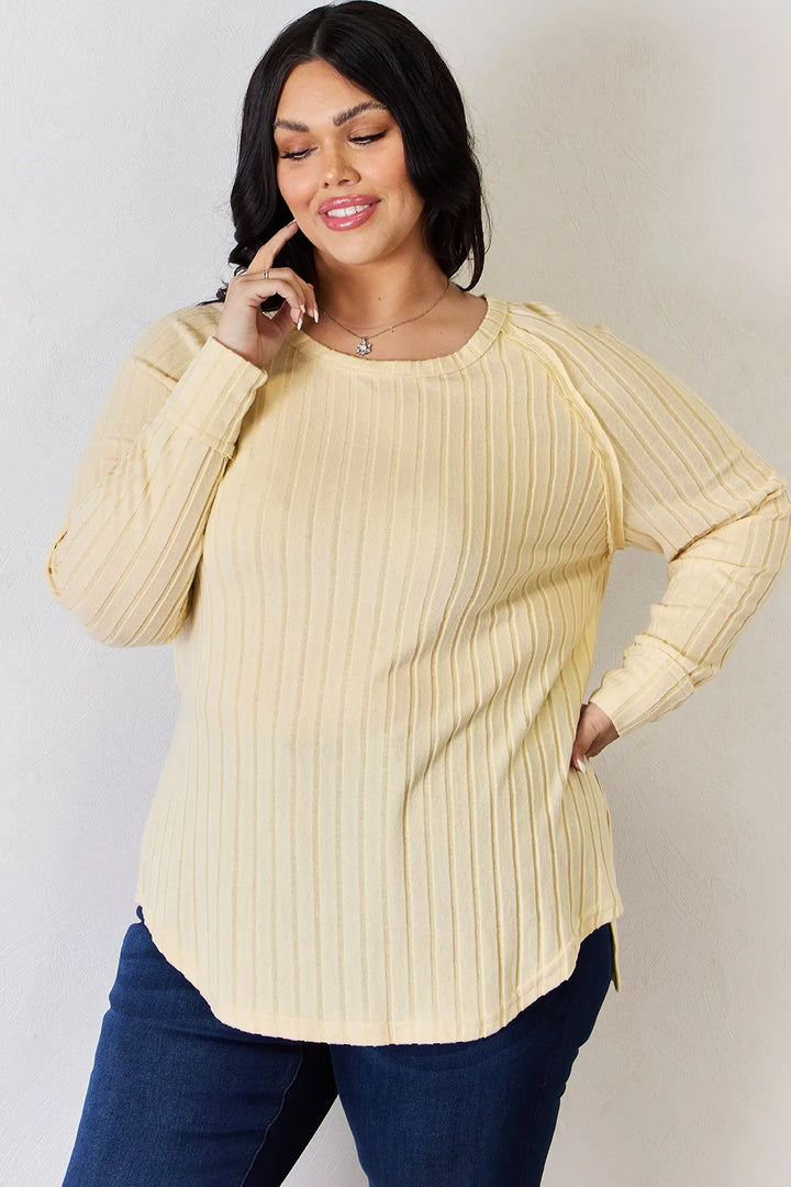 Ribbed knit round neck long sleeve top with side slits
