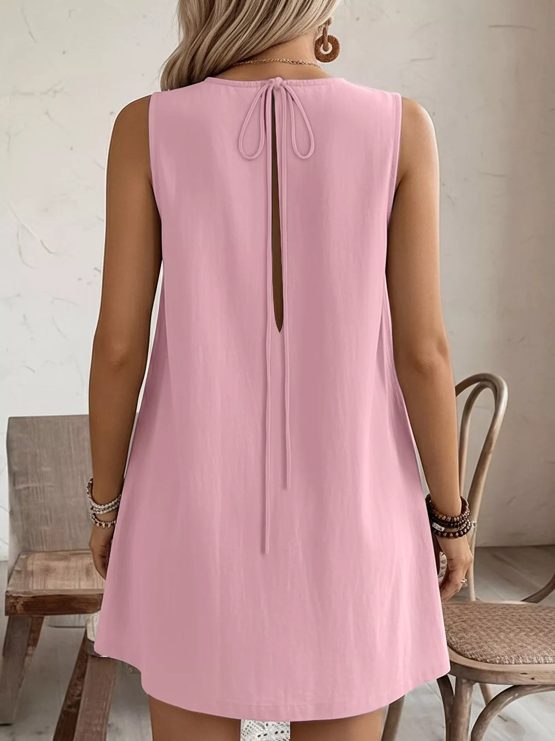 Ruffle-trim sleeveless mini dress with side pockets