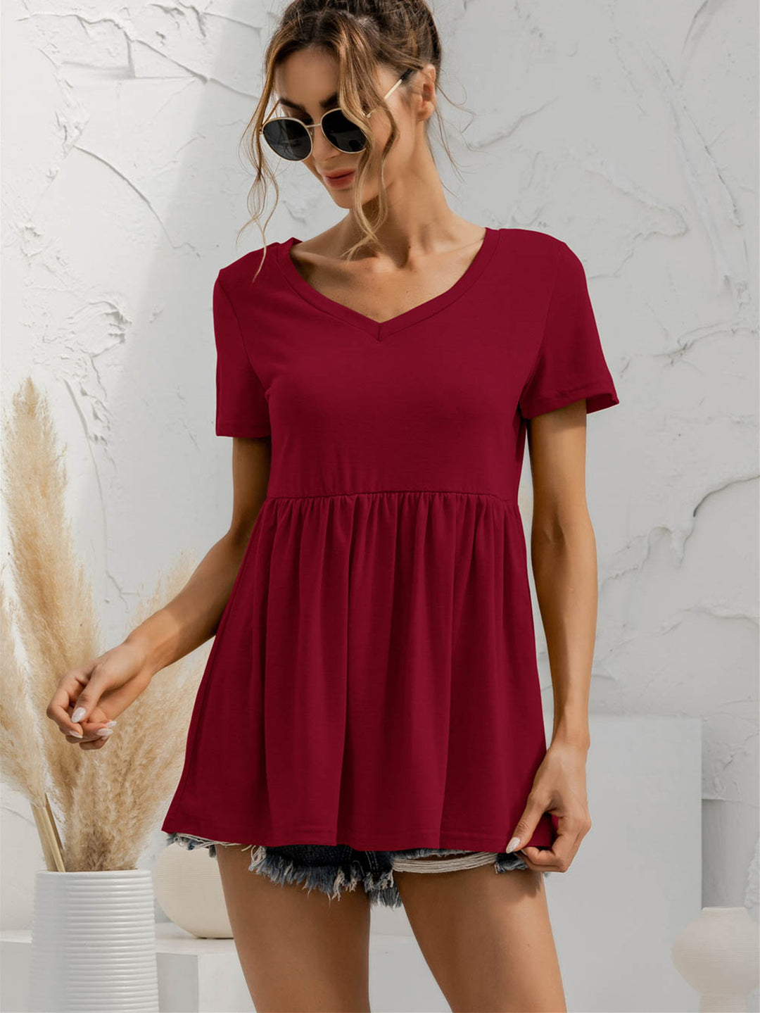 V-neck babydoll top with short sleeves and empire waist