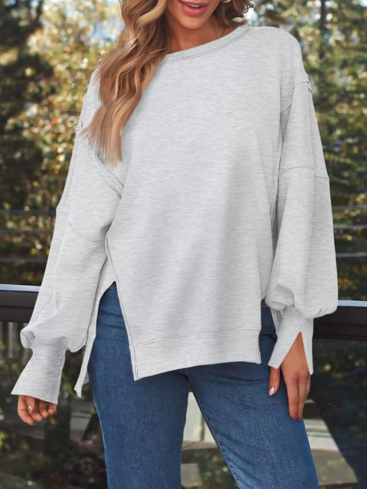 Oversized side-slit sweatshirt with exposed seams