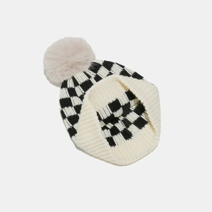 Checkerboard knit beanie with faux fur pompom
