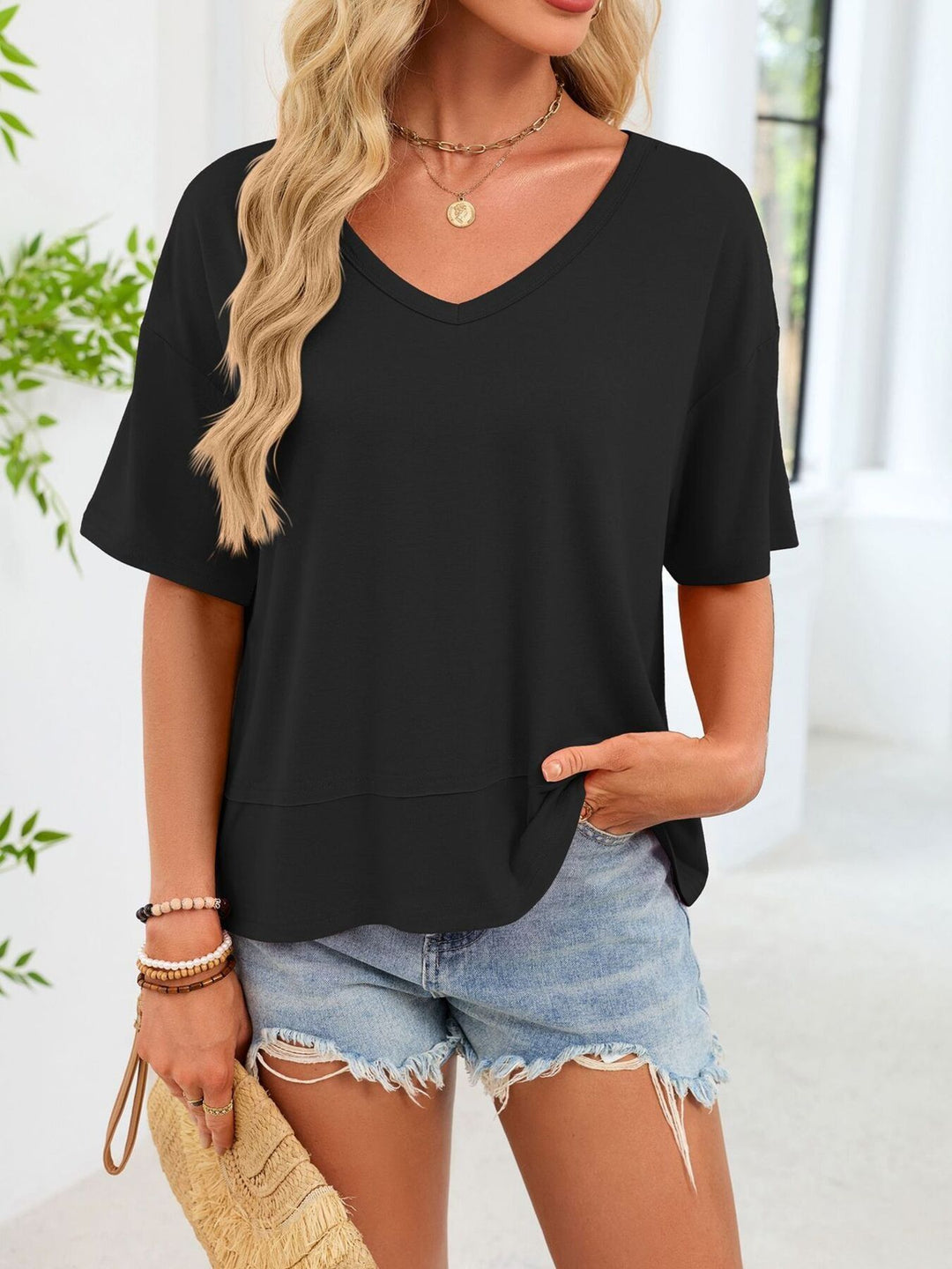 Relaxed-fit V-neck short sleeve tee with raw hem