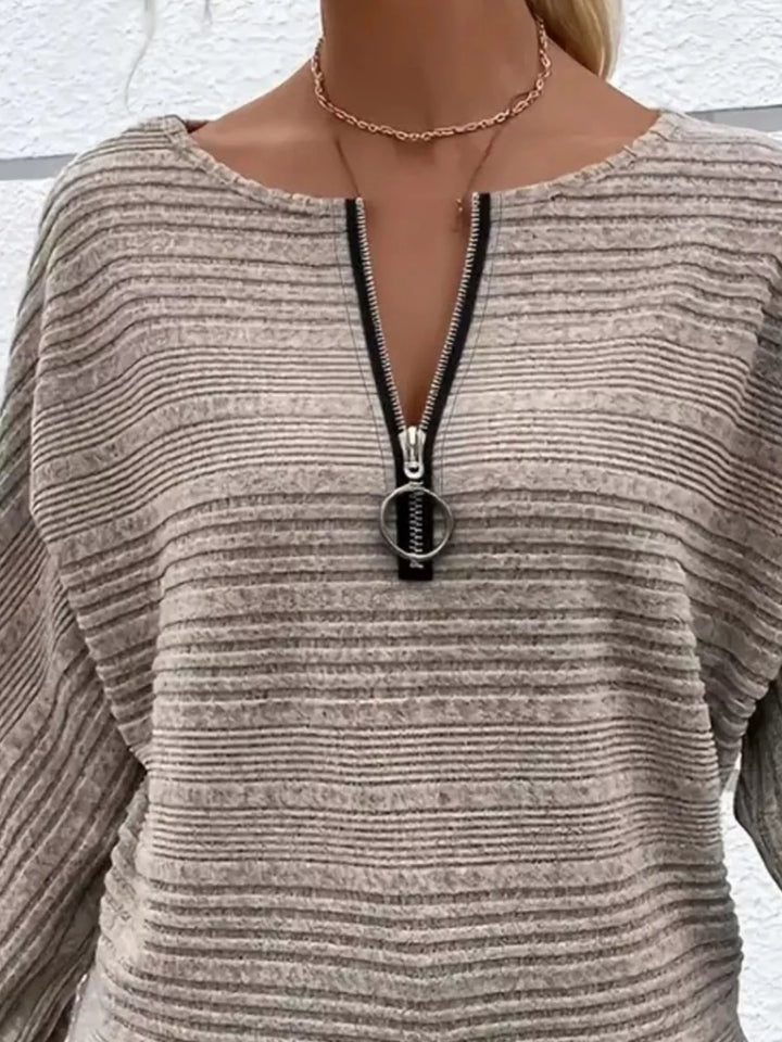 Ribbed knit quarter-zip batwing sweater with O-ring pull