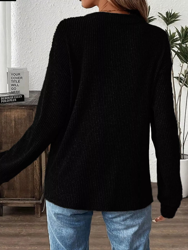 Ribbed knit long sleeve henley top with button placket