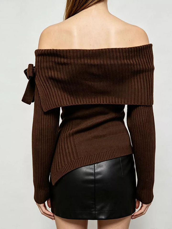 Off-shoulder ribbed knit top with bow cuff and asymmetric hem