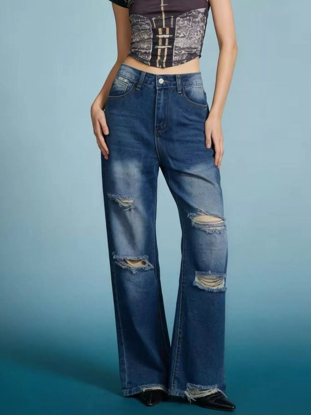 Distressed wide-leg jeans with raw frayed hem