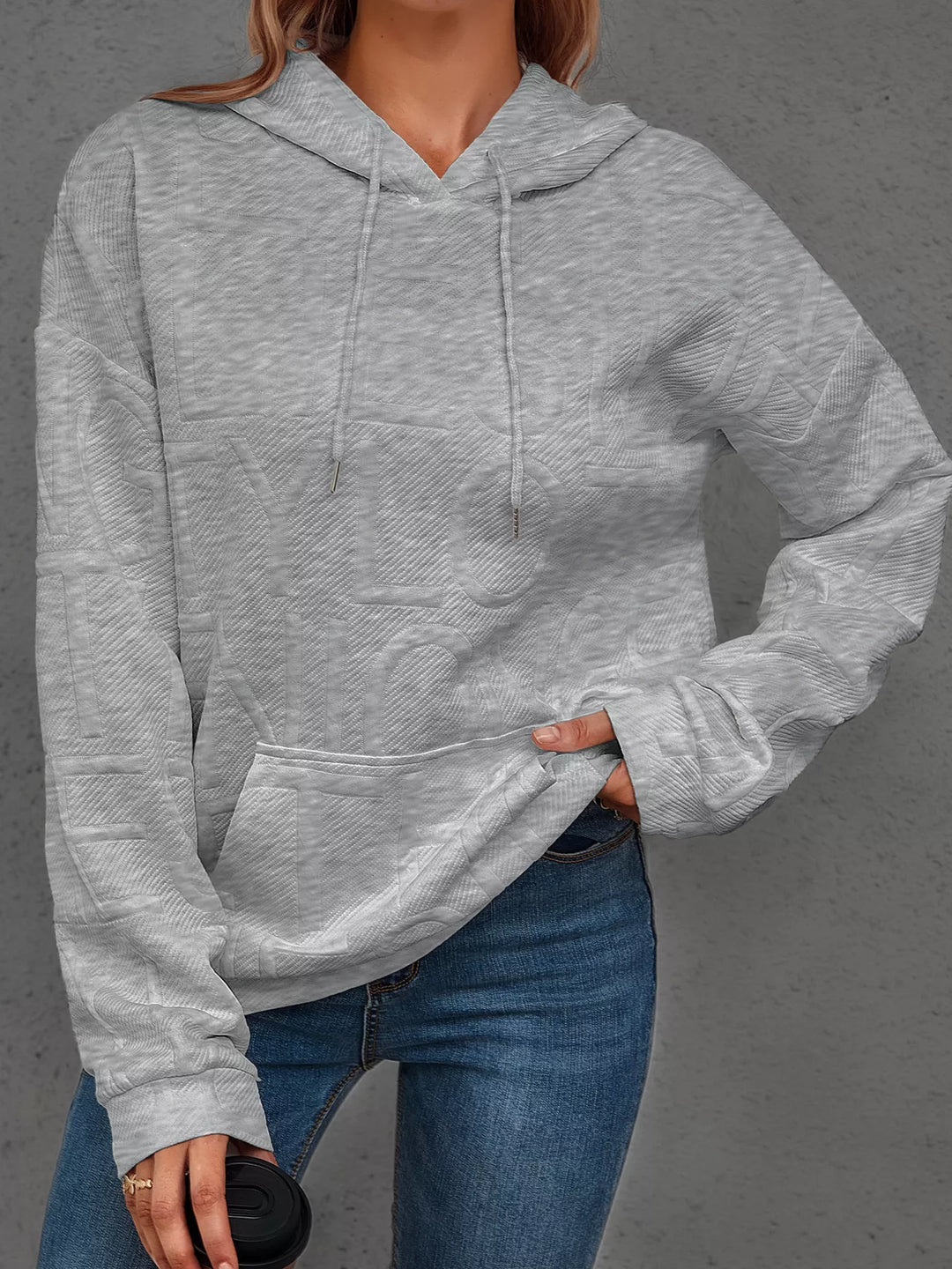 Textured embossed letter pullover hoodie with front pocket
