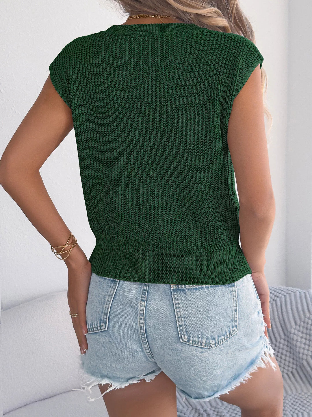 Cable knit cap sleeve sweater with ribbed hem
