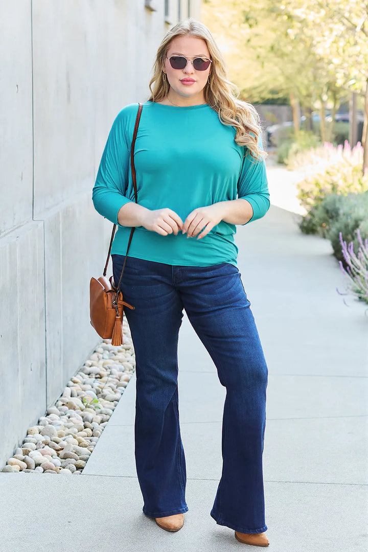 Batwing sleeve top with banded blouson hem