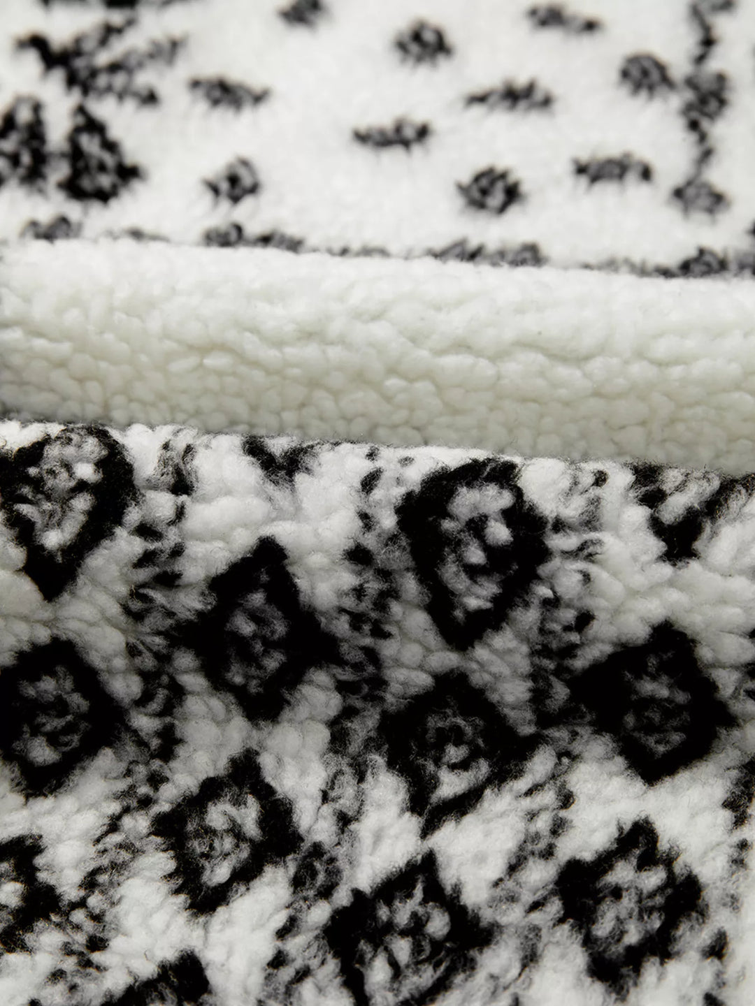 Open-front sherpa vest with paisley print and patch pockets
