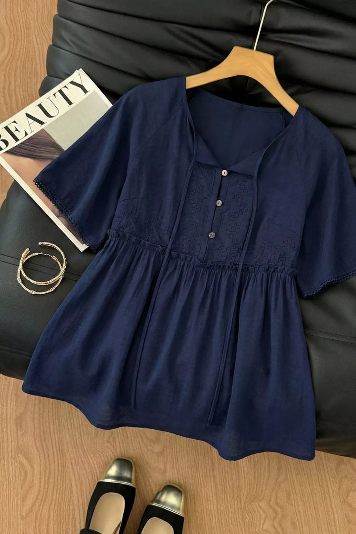 Ruffle hem V-neck blouse with embroidered yoke and lace-trim sleeves