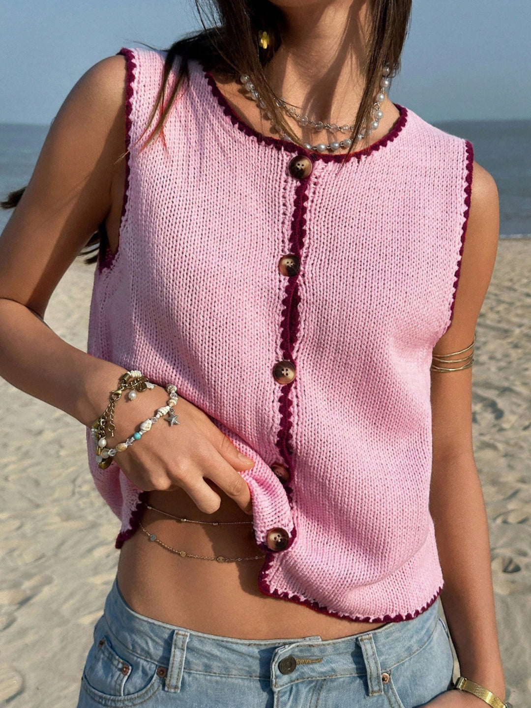 Button-front knit sweater vest with contrast whipstitch trim