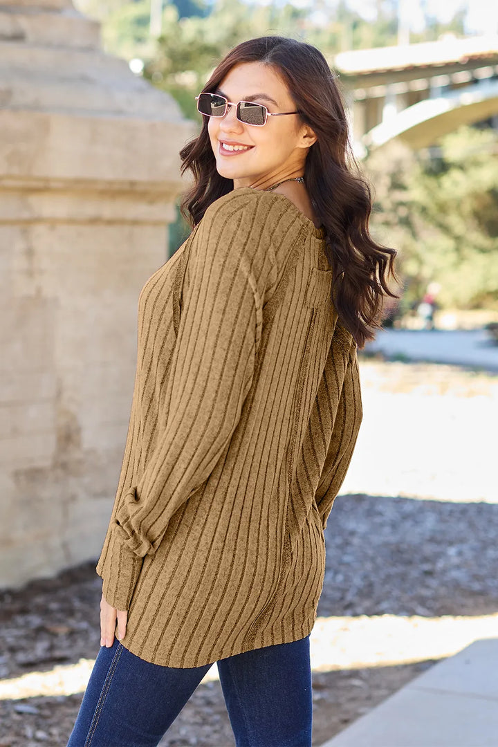 Ribbed knit round neck long sleeve top with curved hem