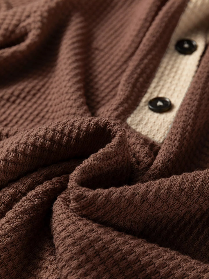 Waffle knit half-button hooded pullover with contrast trim