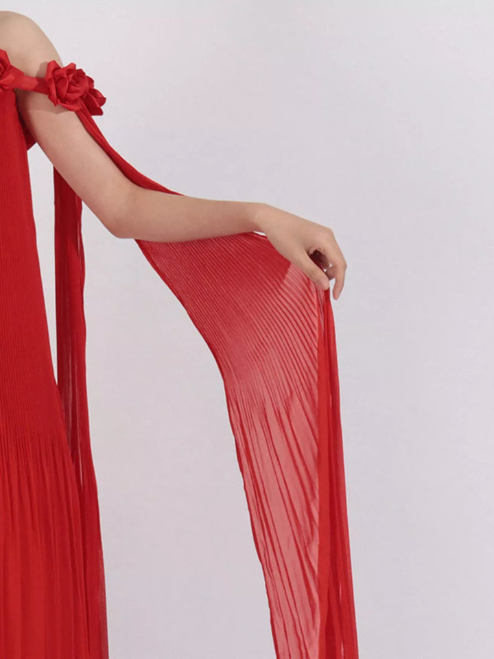 Off-shoulder pleated maxi dress with rosette neckline
