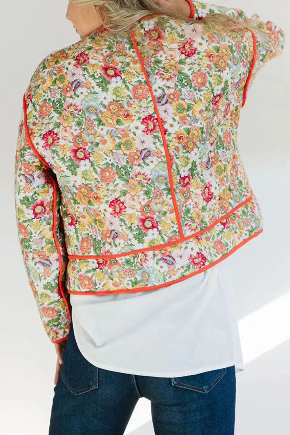 Quilted floral jacket with contrast piped trim and round neck