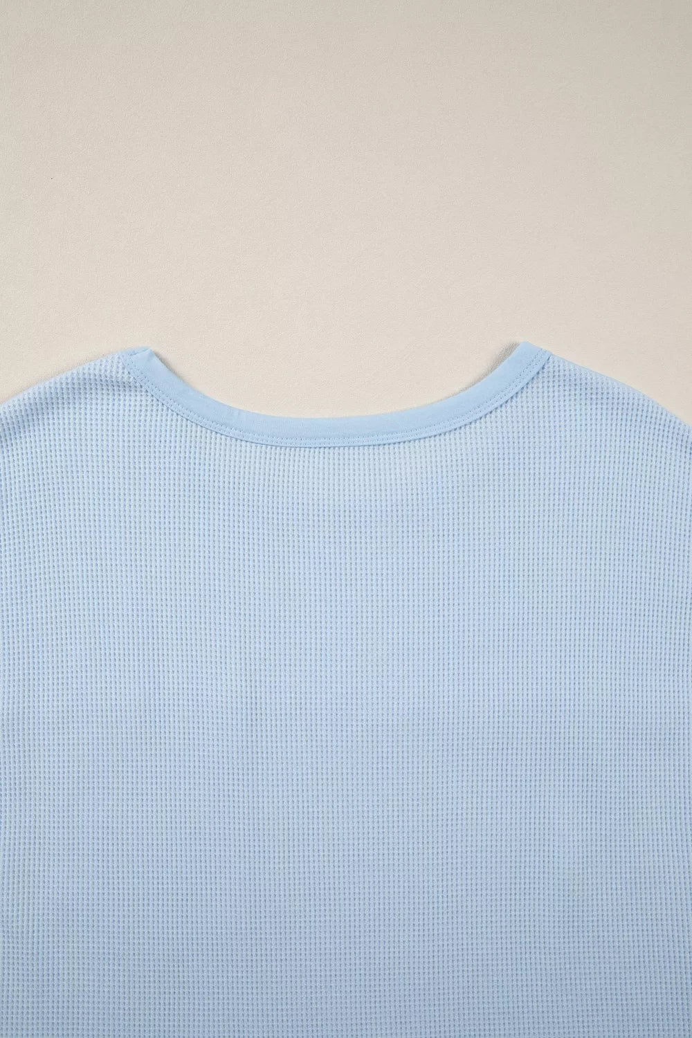 Waffle knit pocket tee with cuffed short sleeves