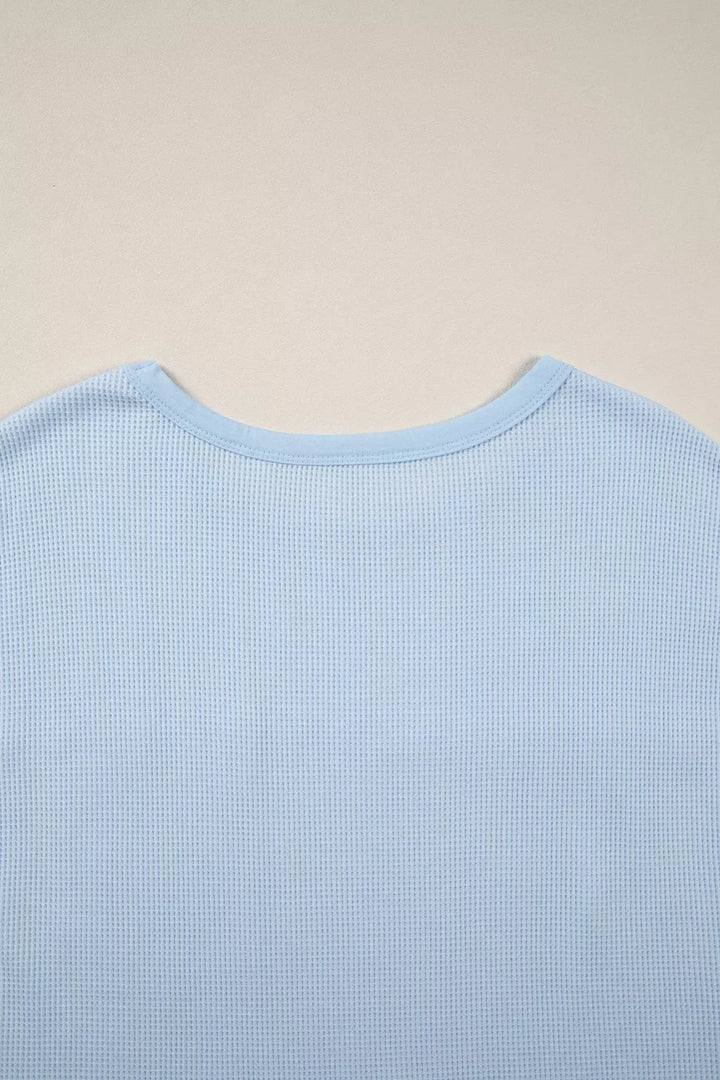 Waffle knit pocket tee with cuffed short sleeves
