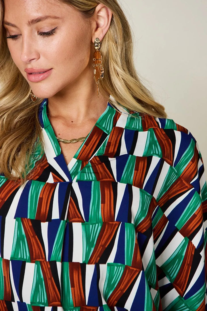 Geometric print notched neck dolman sleeve top