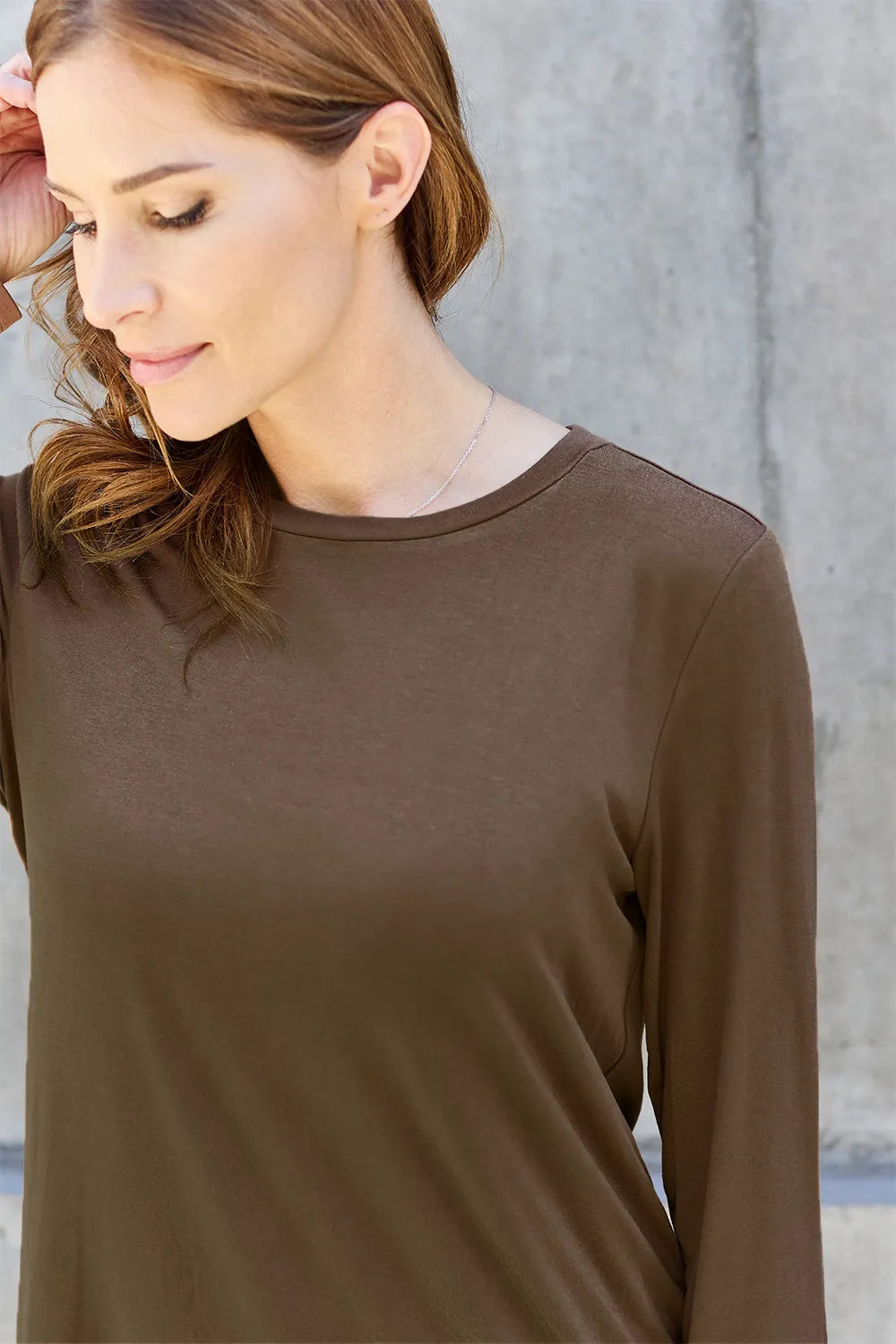 Crew neck long sleeve top with curved hem