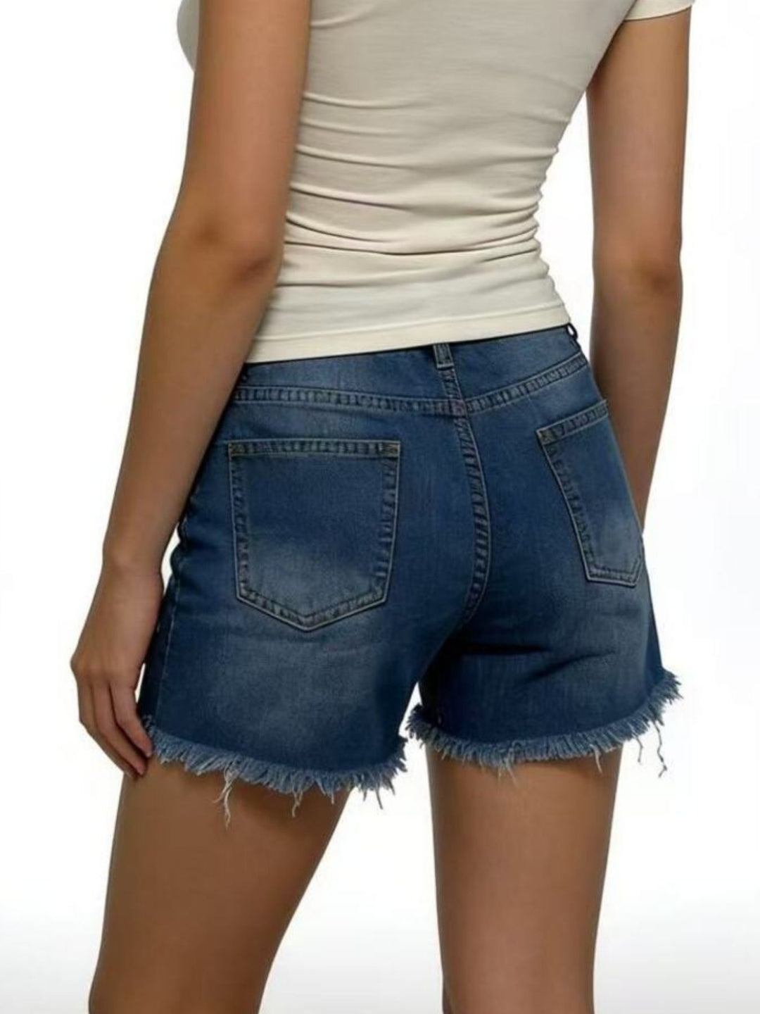 Distressed high-rise denim shorts with frayed raw hem