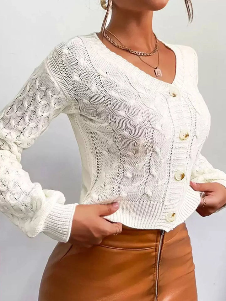 Cropped cable knit button-front cardigan with pointelle sleeves