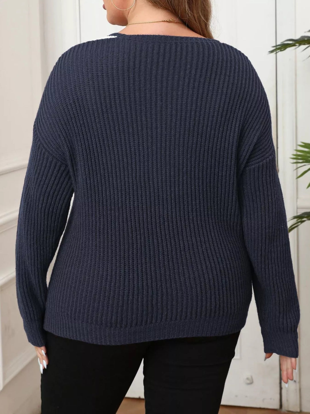 Ribbed knit V-neck sweater with contrast trim and pearl buttons