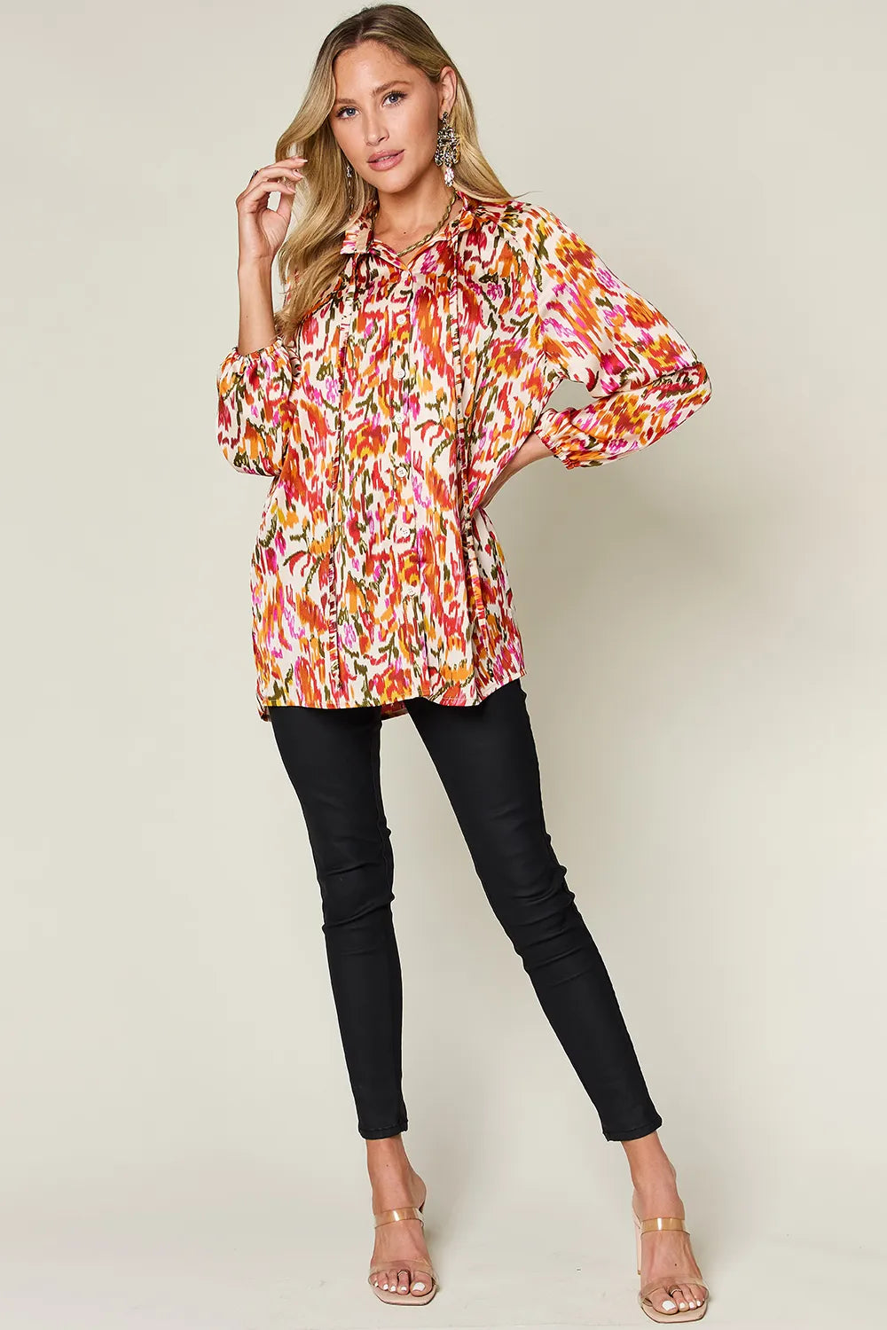 Abstract print button-up shirt with tie neck and long sleeves