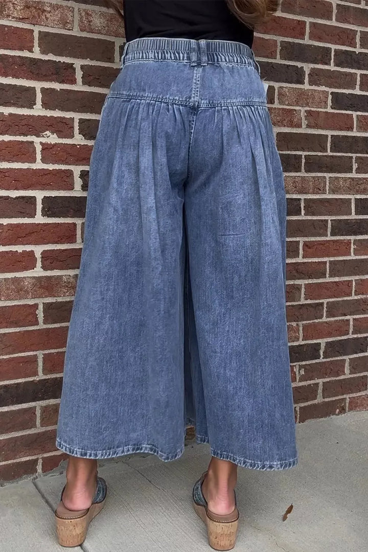 High-rise wide-leg button-fly jeans with pleated waist