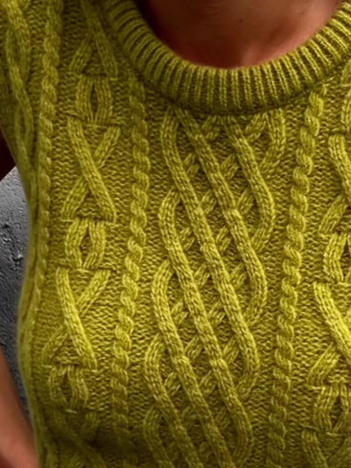 Cable knit sweater vest with ribbed crew neck