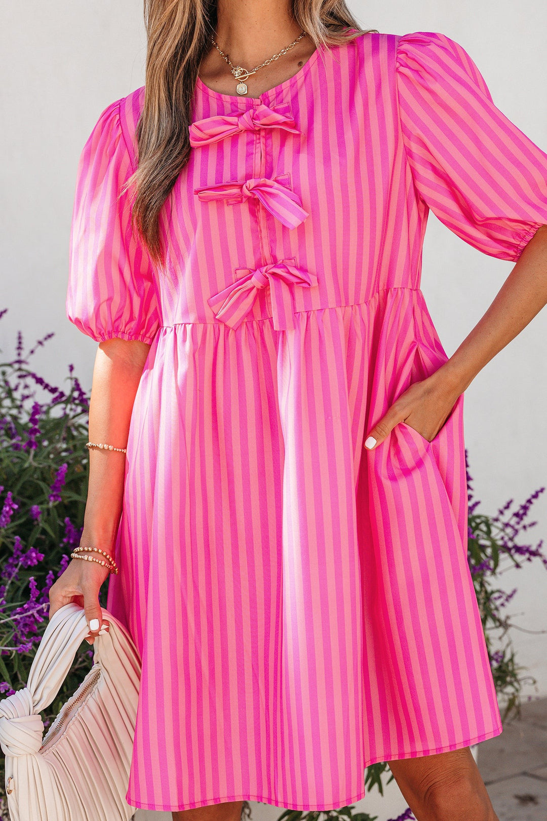 Striped puff sleeve mini dress with triple bow front