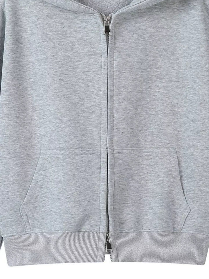 Zip-up hoodie with front pockets and ribbed cuffs