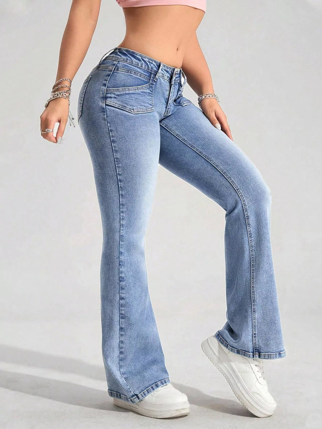 Low-rise flare jeans with flap front pockets and faded wash
