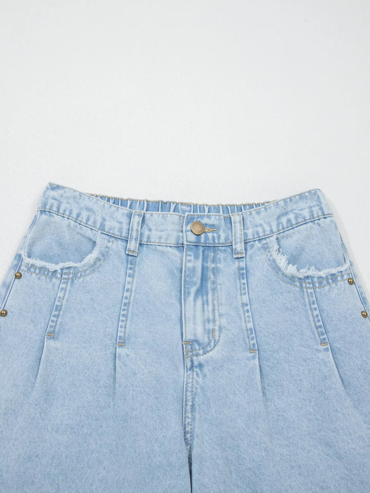 Studded wide leg jeans with side slits and frayed hem