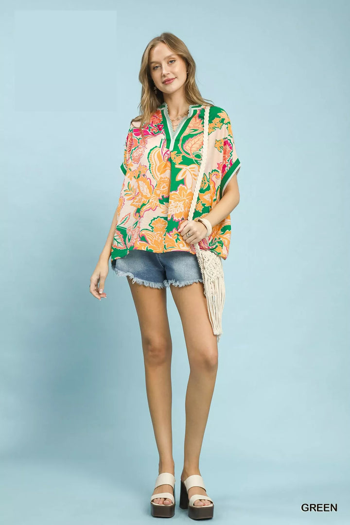 Oversized floral print top with V-neck and lace trim