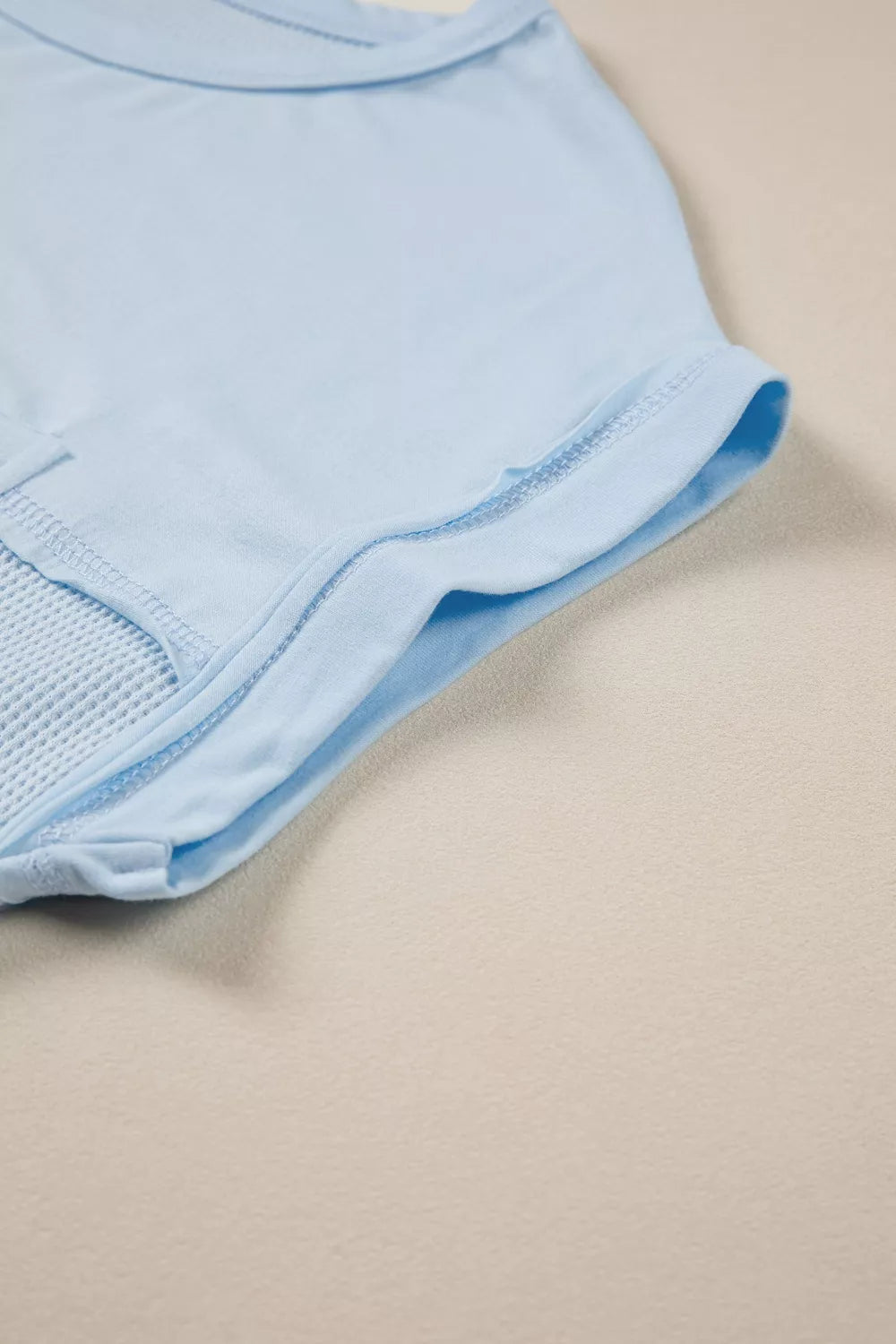 Waffle knit pocket tee with cuffed short sleeves