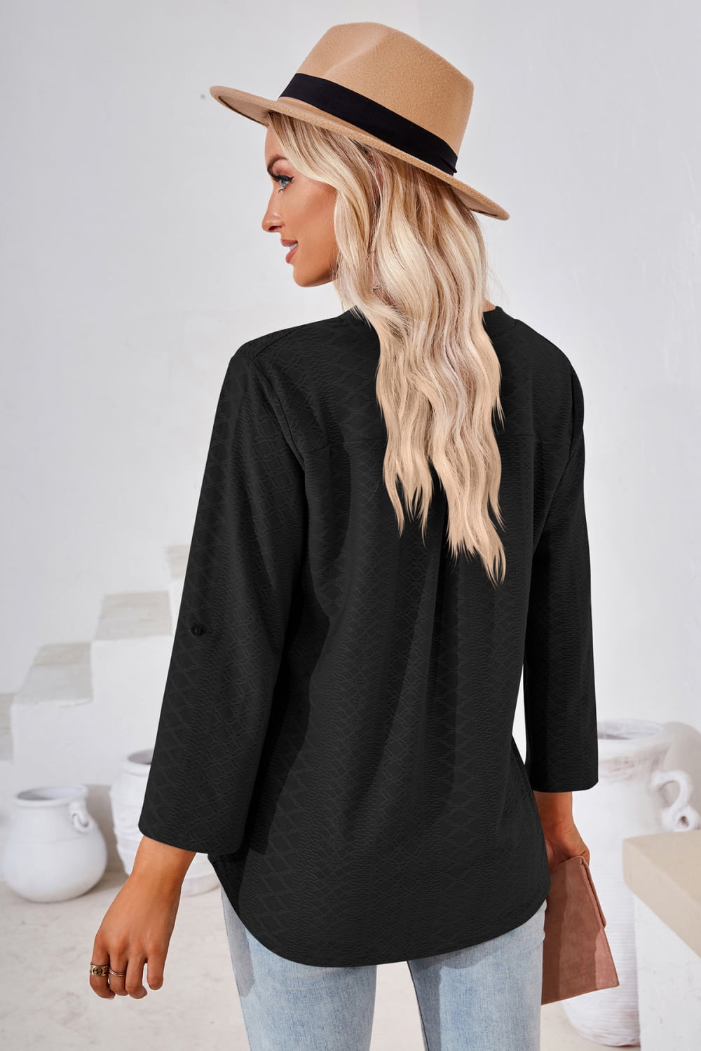Textured split v-neck blouse with roll-tab sleeves