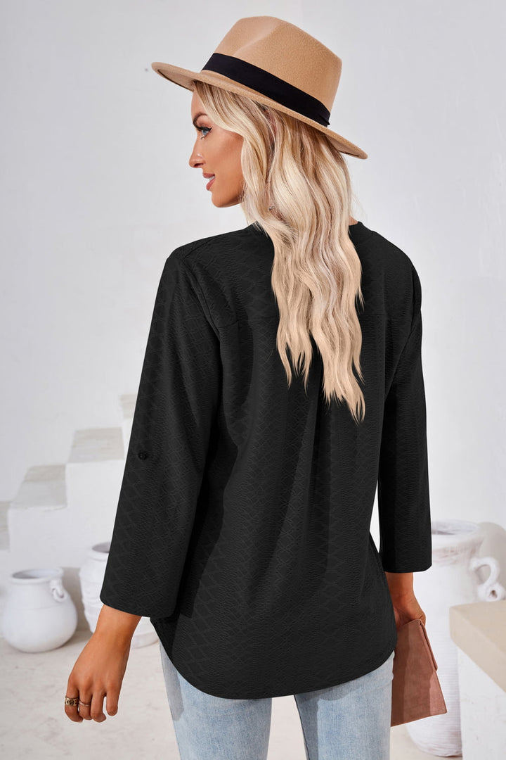 Textured split v-neck blouse with roll-tab sleeves