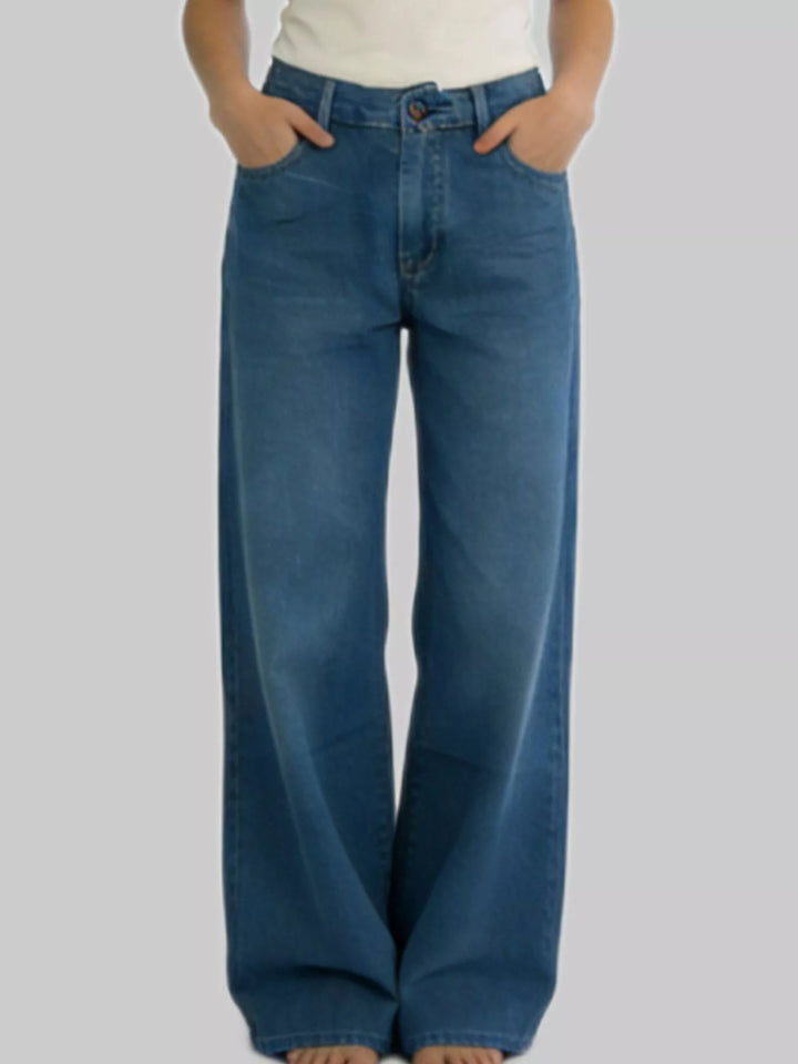 High-rise wide-leg jeans in faded mid-wash denim