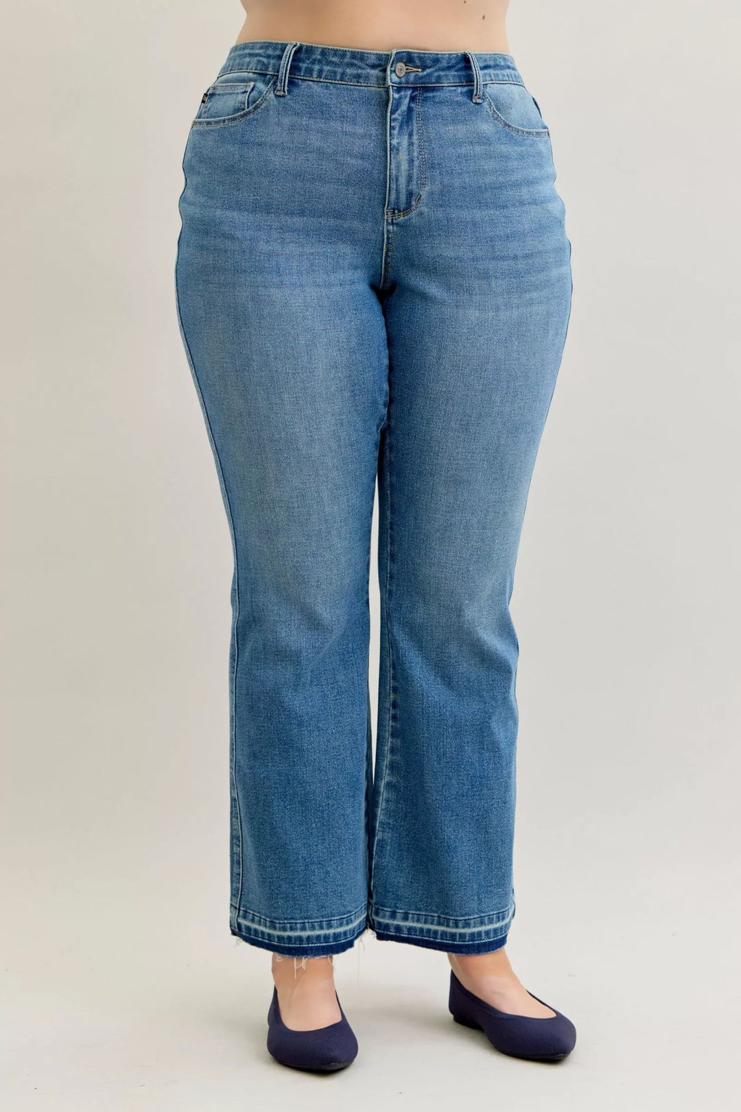 Mid-rise slim bootcut jeans with release hem and tummy control
