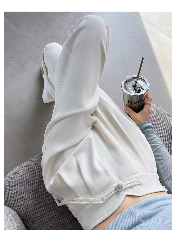 High-rise wide-leg pants with pleated front and tie waist