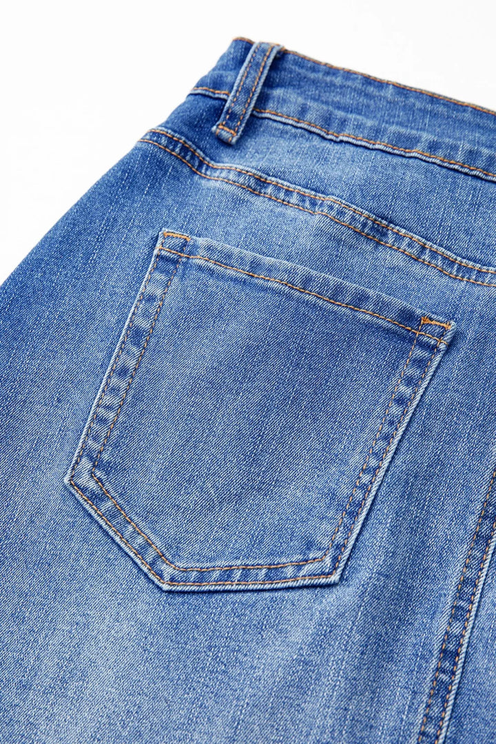 Wrap-front denim mini skirt with angled hem seam