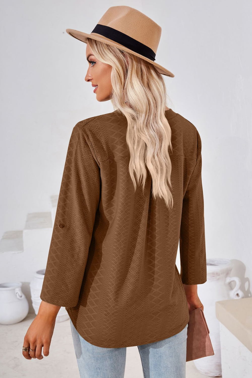 Textured split v-neck blouse with roll-tab sleeves