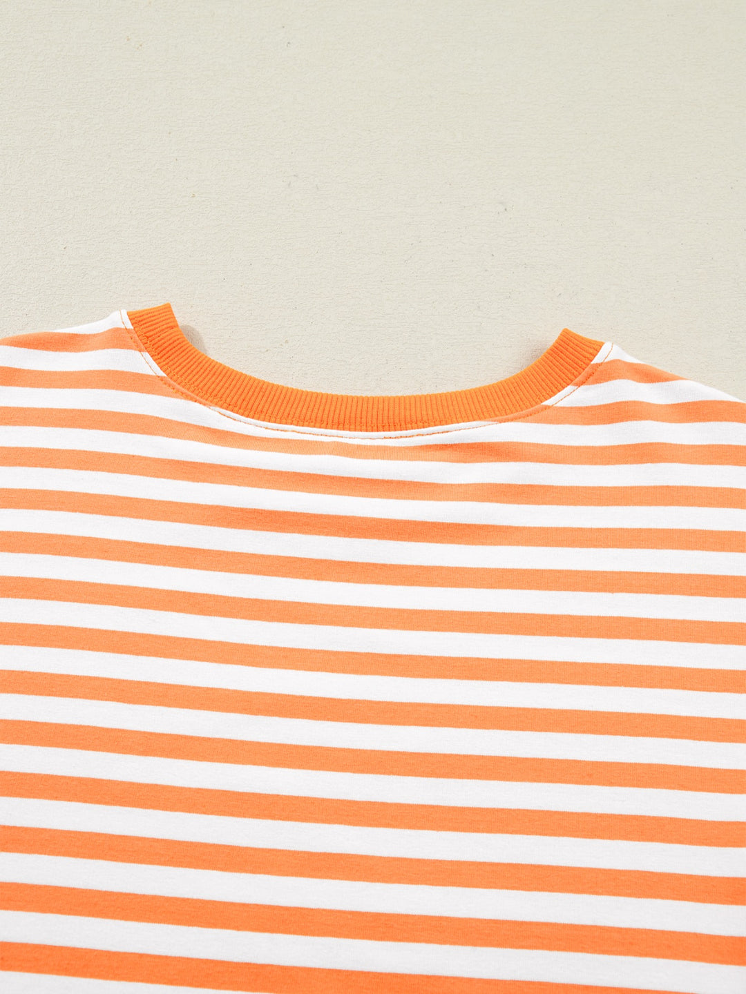 Striped exposed-seam 3/4 sleeve pullover top