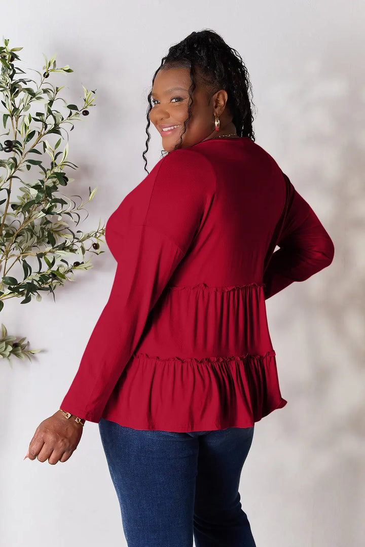 Half-button long sleeve blouse with tiered ruffle hem