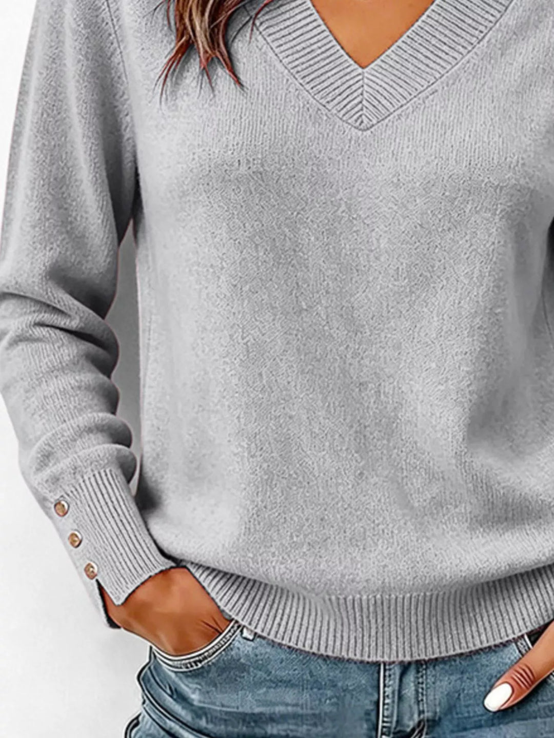 V-neck long sleeve sweater with button cuffs and side slits